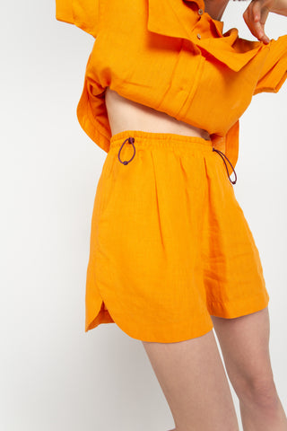 Orange elasticated shorts